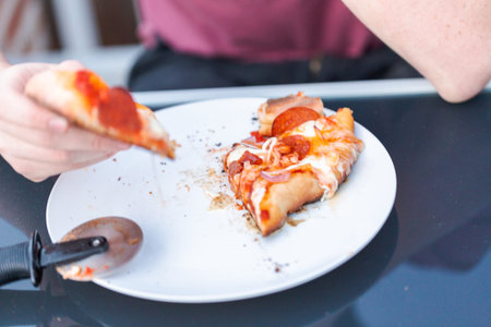 Cooking pizza on outdoor gas grill.