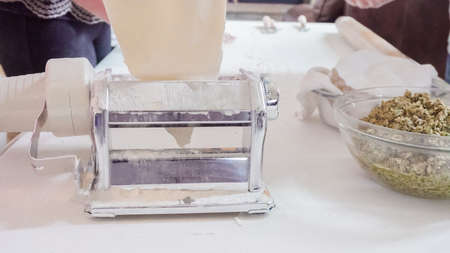 Making Italian raviolis from scratch at the Italian party.の写真素材