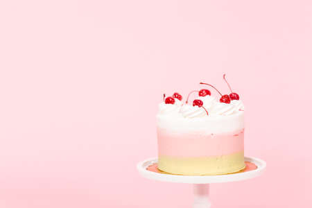 Birthday Spumoni cake on pink background.の写真素材