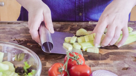 Slicing fresh vegetables for Spring salad.の写真素材