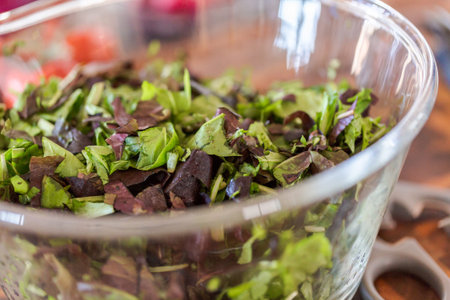 Preparing fresh salad with organic veggies.