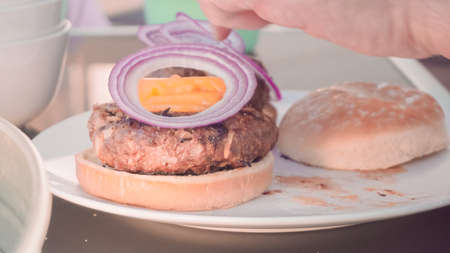 Gourmet classic beef burger on deli bun.の写真素材