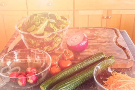 Preparing fresh salad with organic veggies.