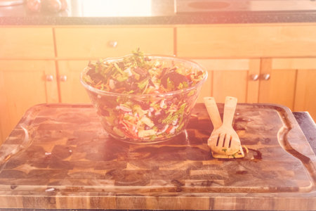 Preparing fresh salad with organic veggies.