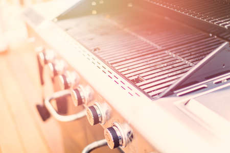 Dirty cast iron cooking grates on 6 burner outdoor gas grill.の写真素材