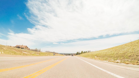 POV-Driving on rural paved road in Colorado.