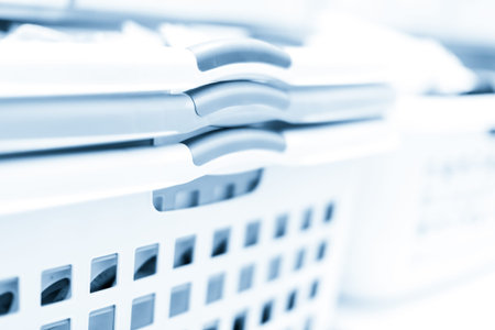 Doing laundry in laundry room of modern single family house in suburbs.の写真素材