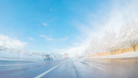 Driving on suburban road after Spring snow storm.