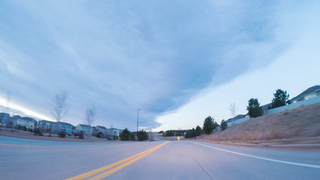 Driving on suburban road early in the morning.