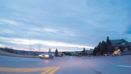 Driving on suburban road early in the morning.