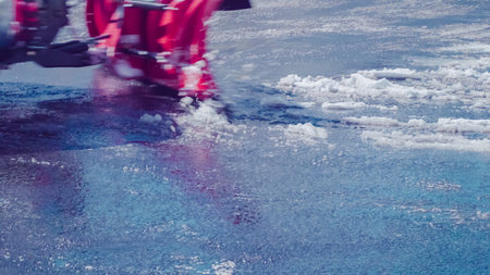 Snow plow clearing residential streets from Spring snow stor.