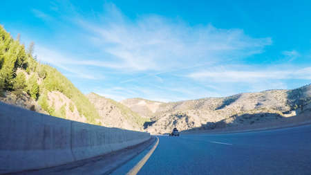 Driving on interstate highway I70 in the mountains.の写真素材