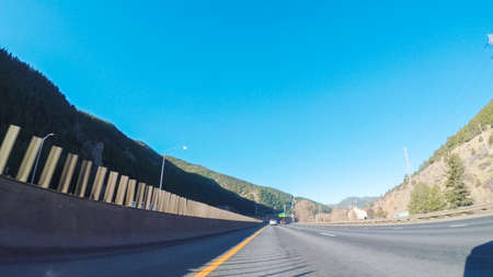 Driving on interstate highway I70 in the mountains.の写真素材