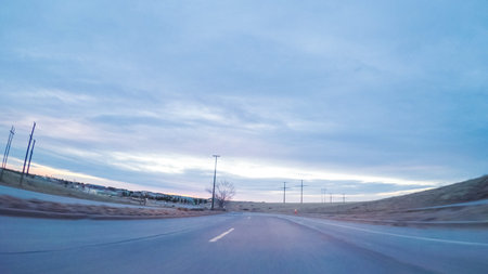 Driving on suburban road early in the morning.