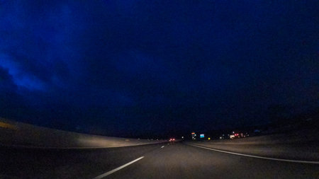 Driving on Interstate highway I25 at night.