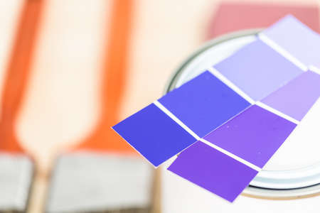 Paint swatches with purple paint sample and metal can with paint.の写真素材