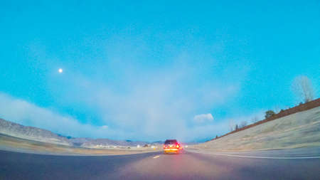 Driving on statehighway 470 at sunrise.の写真素材