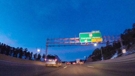 Denver, Colorado, USA-January 27, 2018-POV-Driving on Interstate highway I70 in the mountains at night.の写真素材