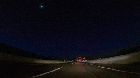 Driving on Interstate highway I25 at night.