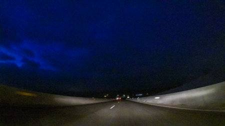 Driving on Interstate highway I25 at night.