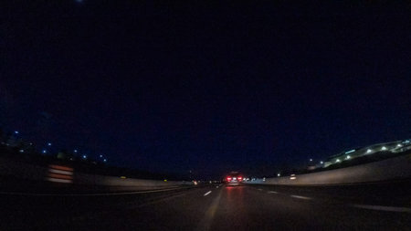 Driving on Interstate highway I25 at night.