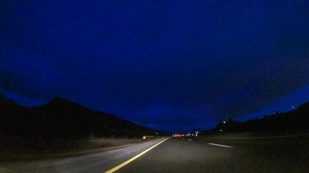 Driving on Interstate highway I25 at night.