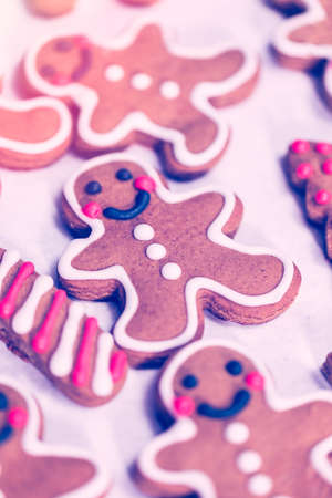 Decorating traditional gingerbread cookies with royal icing for Christmas.の写真素材