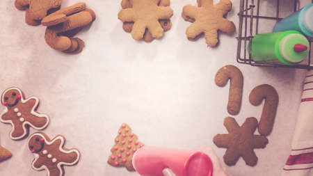 Decorating gingerbread cookies with royal icing for Christmas.の写真素材