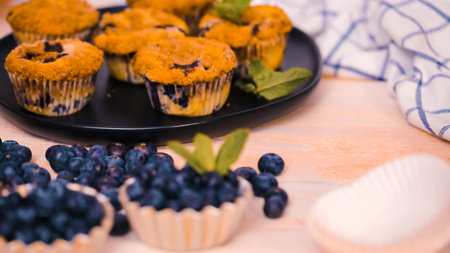 Out of the oven blueberry muffins with cinnamon and sugar topping.の写真素材