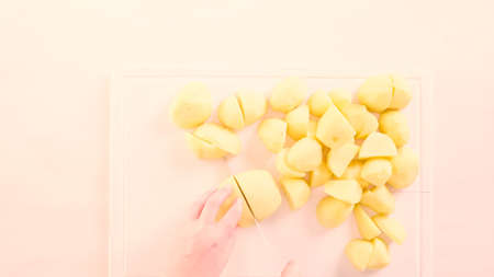Step by step. Slicing Yukon gold potatoes for classic mashed potatoes.の写真素材