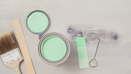 Home inprovement project. Painting wood with turquose color paint.