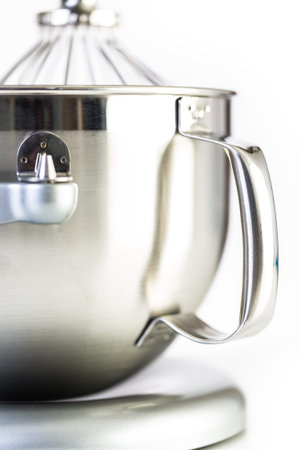 Silver food electric mixer on a white background.