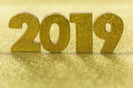 Gold numbers of 2019 year on a gold background.