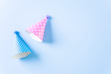 Colorful party hats for kids Birthday Party on blue background.の写真素材