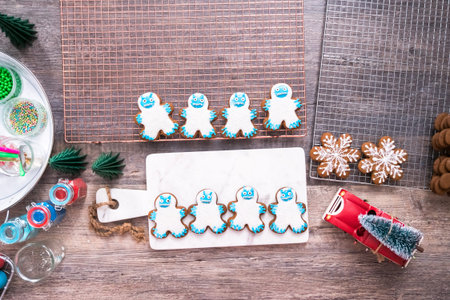 Flat lay. Decorating gingerbread cookies with royal icing.