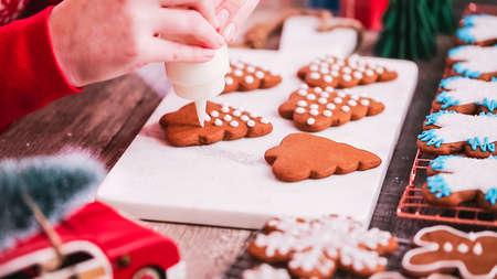 Step by step. Decorating gingerbread cookies with royal icing.の写真素材