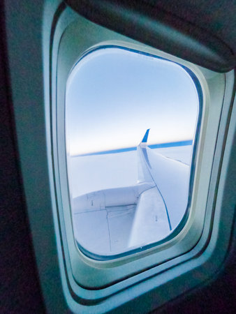 View of the sunrise from the inside of passanger airplane.