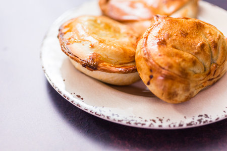Homemade large empanadas with different staffings.