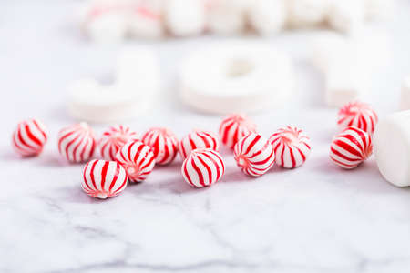 Close up view. Variety of marshmallow toppings with peppermint for hot chocolate and cocoa drinks.の写真素材