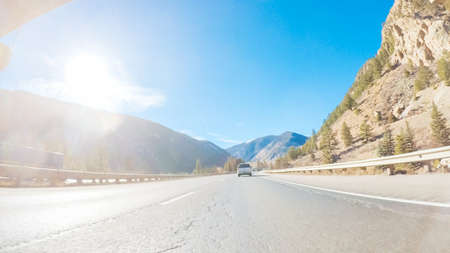 Drivign West on interstate highway I70 through the mountains.の写真素材