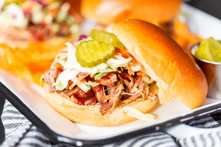 BBQ pulled pork sandwich with coleslaw on brioche buns.