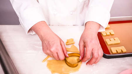 Step by step. Cutting out shapes from sugar cookie dough with cookie cutters.の写真素材