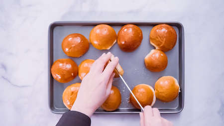 Flat lay. Step by step. Brioche buns on a metal tray to make pulle dpork sandwiches.の写真素材