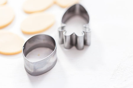 Easter themed metal cookie cutters on the table.