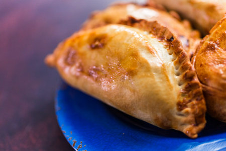 Homemade large empanadas with different staffings.