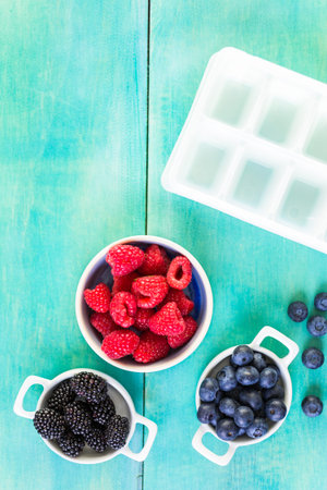 Making fresh fruit ice cubes for summer drink.の写真素材