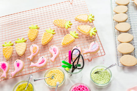 Decorating Easter sugar cookies with rotal icing.