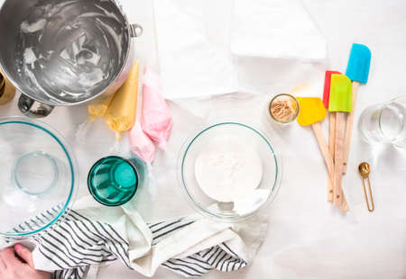 Flat lay. Making royal icing to decorate Easter sugar cookies.の写真素材