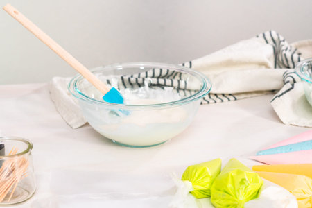 Making royal icing to decorate Easter sugar cookies.