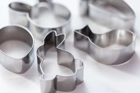 Easter themed metal cookie cutters on the table.の写真素材